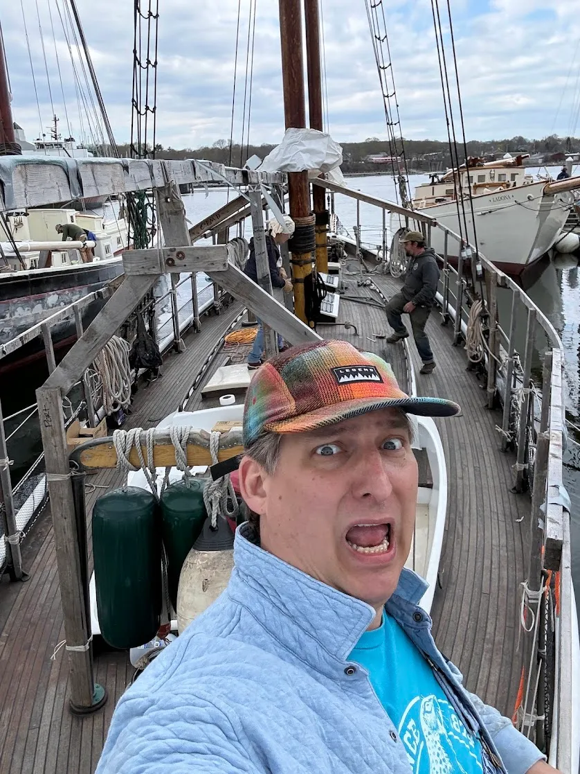 On the deck of the schooner, looking unhinged